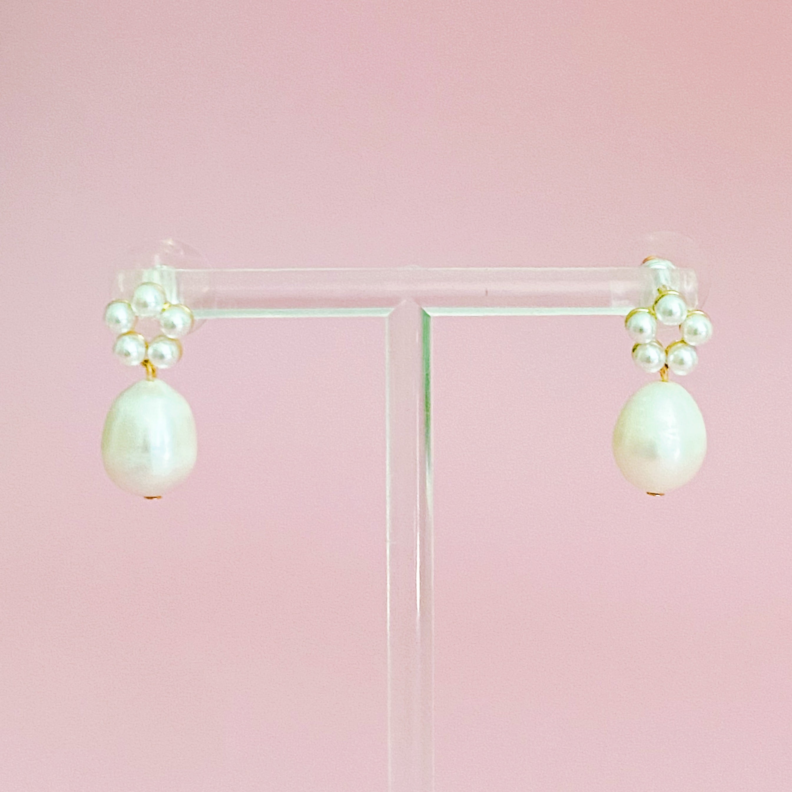 Pearl drop earrings worn