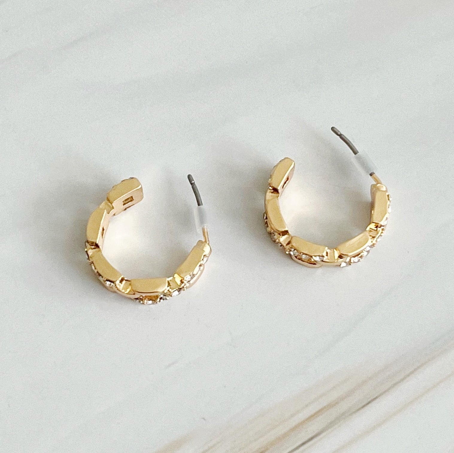 Pave huggie hoops worn