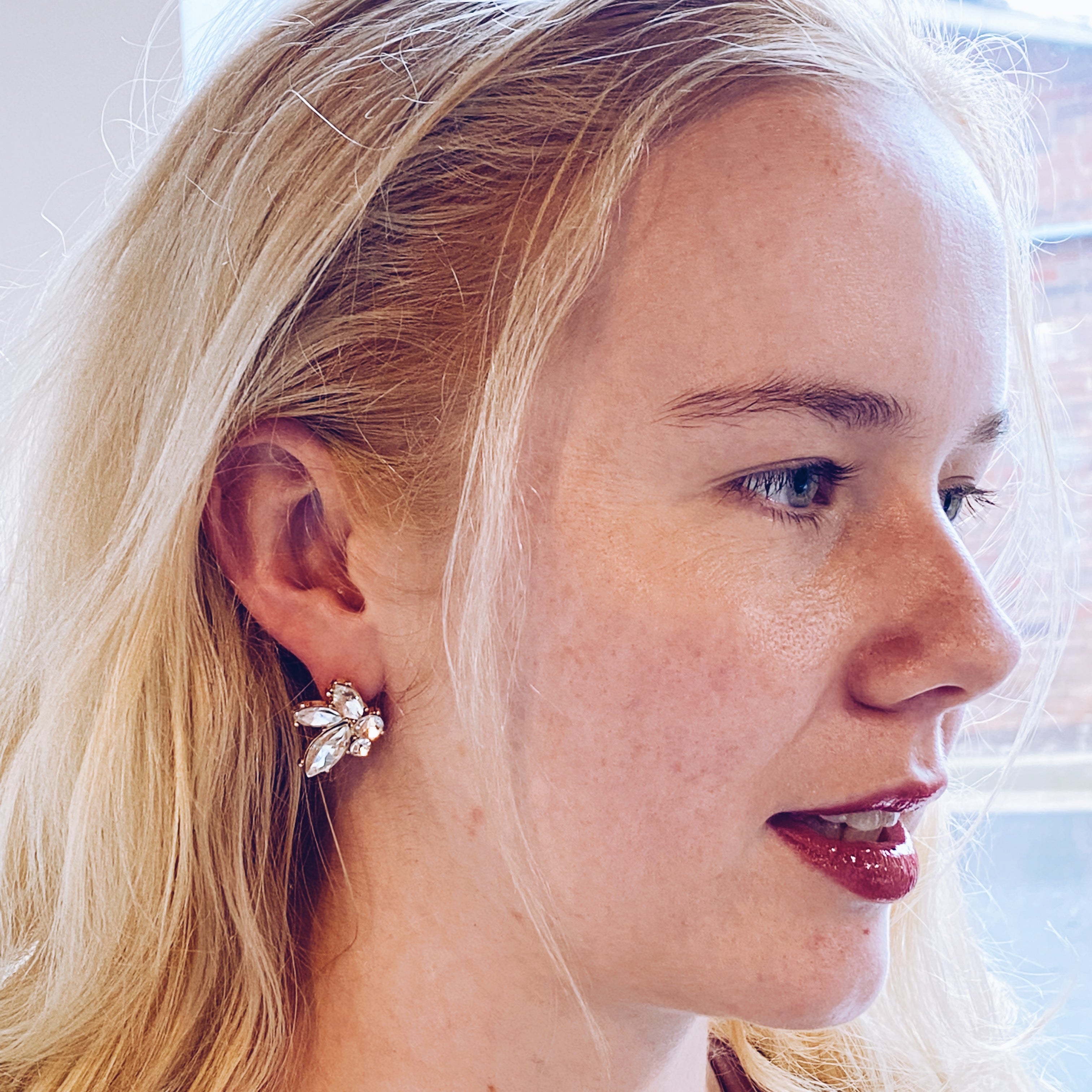 Stud earrings worn